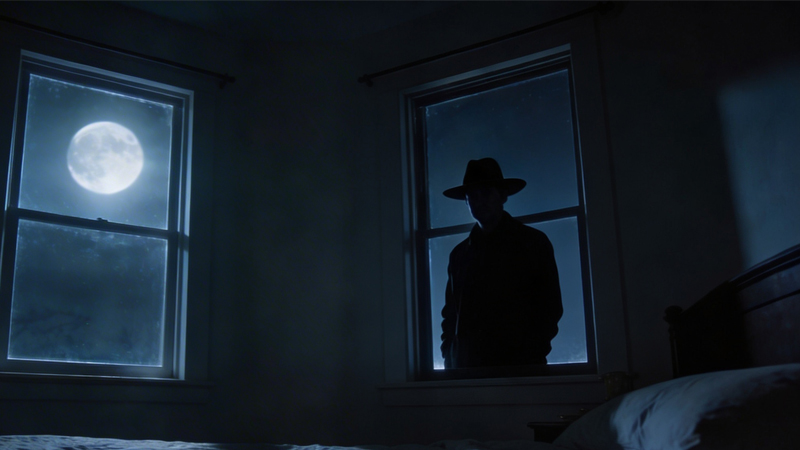 El Hombre del Sombrero o Hat Man mirando desde la ventana